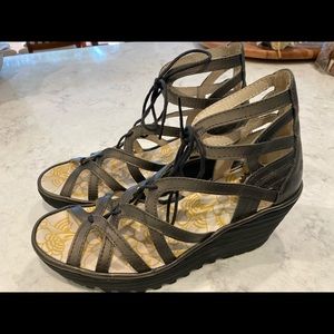 Pewter colored Fly brand wedge sandals